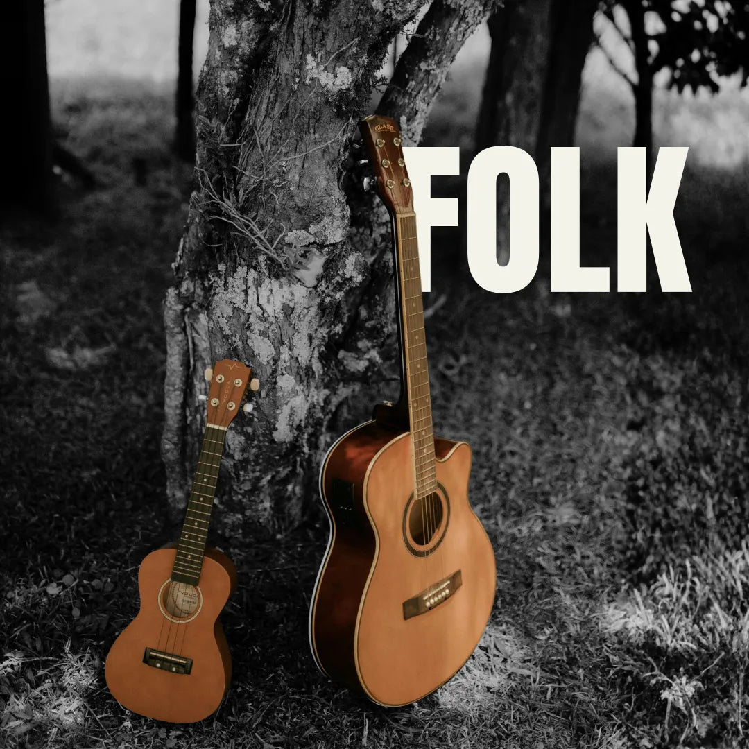 Acoustic guitar and ukulele leaning against a rustic tree trunk in a black and white forest setting.