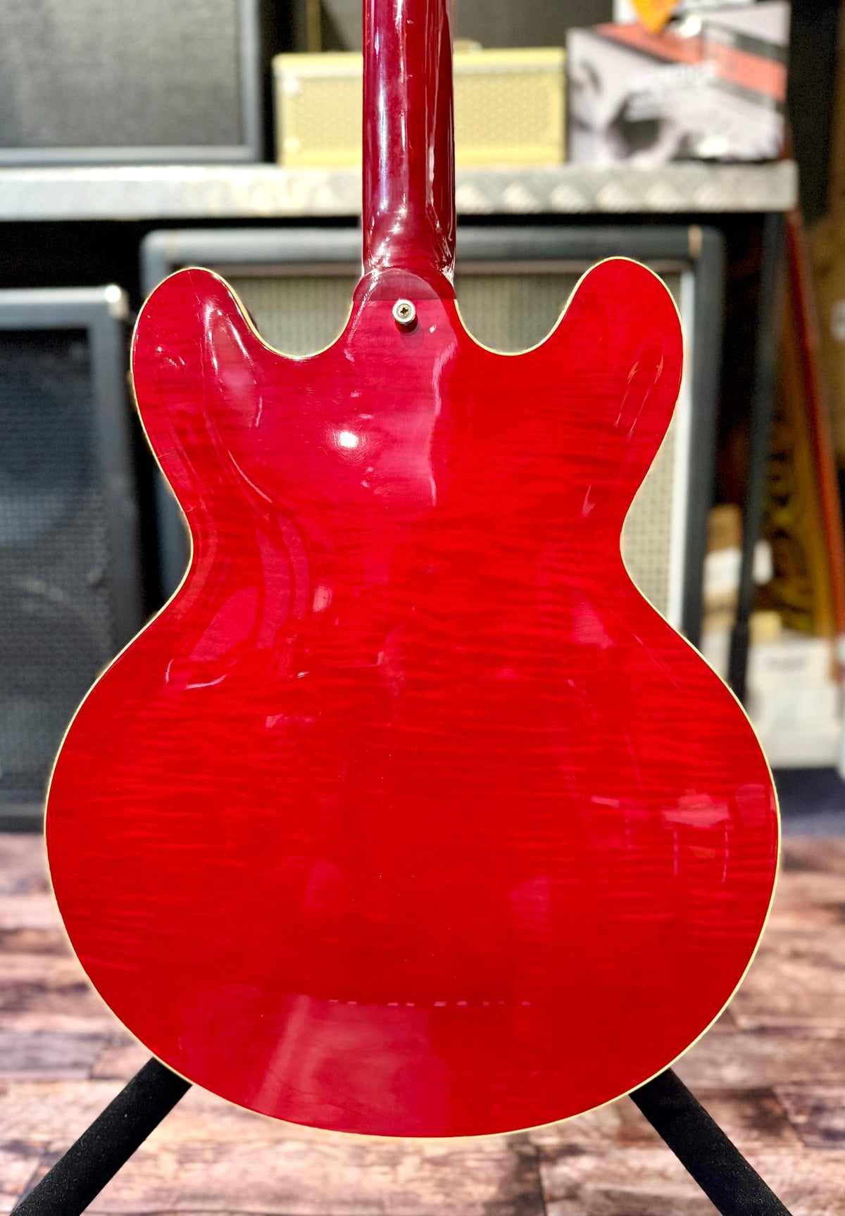 Straight-on view of the full back of the body showing the symmetrical flame maple pattern across the finish.