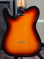 Full back view showing the bolt-on neck plate with the CE and model markings, and the string-through-body ferrules.