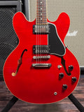 Straight-on front view of the body showing the black pickguard, four control knobs, toggle switch and end pin.