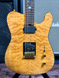 Front view of the Aria Pro II TEG-780N in a natural-finish quilted maple top, showing the Telecaster-style body, neck humbucker and single-coil bridge pickup.