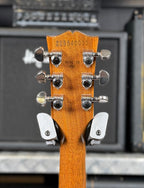 Close-up of the back of the headstock showing the factory serial number 225840032, nickel tuners and the Made in USA stamp.
