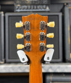 Close-up of the back of the headstock showing the factory serial number 206450217, vintage-style tuner buttons and the Made in USA stamp.