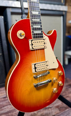 Full upper-body view showing the toggle switch, cutaway and the sunburst fading across the maple top.