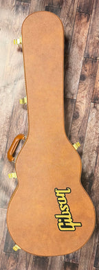 The included tan Gibson hardshell case, shown closed with its yellow Gibson logo and leather handle.