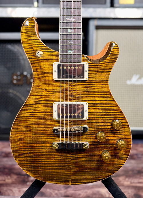Close-up front view of the PRS McCarty 594 in Yellow Tiger, showing the flame maple top figuring, twin humbuckers, gold hardware and bird fretboard inlays.