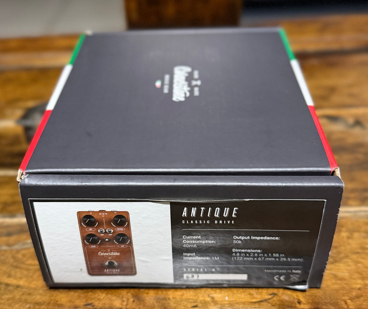The Cornerstone retail box for the Antique Classic Drive, with red, white and green edge trim, a product photo and printed specifications including current consumption, impedance, dimensions and serial number, marked handmade in Italy.