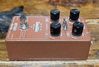 Low-angle view of the pedal from the opposite corner, showing the same controls with the footswitch positioned on the left.