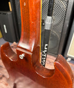 Close-up of the back of the neck-to-body joint on the Gibson SG Deluxe, showing the set-neck heel and a strap button.