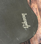 Close-up of the hardcase lid showing the 'Gibson' logo printed on the case covering.