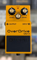 Front view of the Boss OD-3 OverDrive pedal in its yellow casing, showing the Level, Tone and Drive knobs and black footswitch.